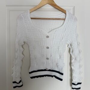 White textured pearl button-up sweater